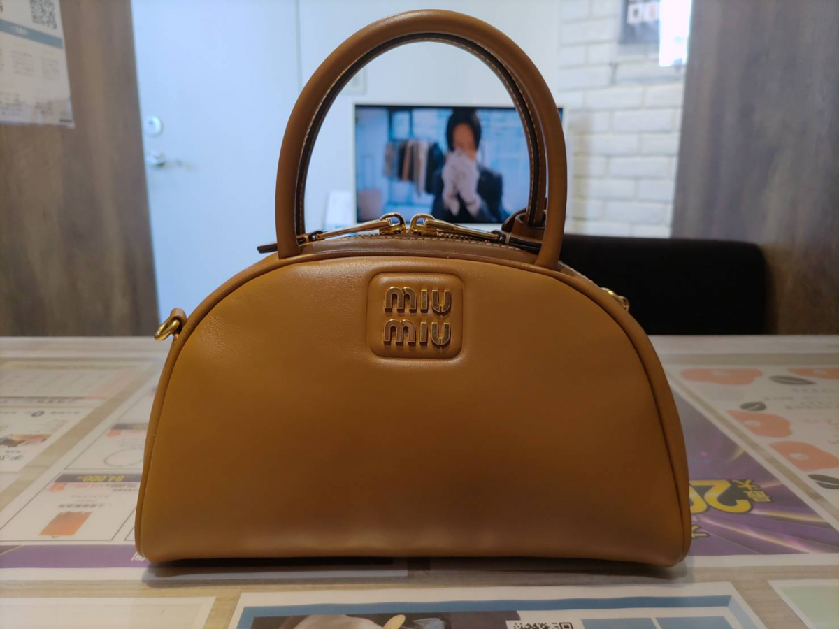 美品】 miu miu ブラウンキャンバス×レザー バックパック保存袋と保証書